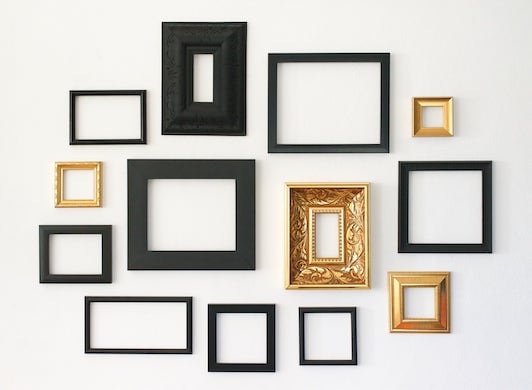 Various picture frames hanging on wall